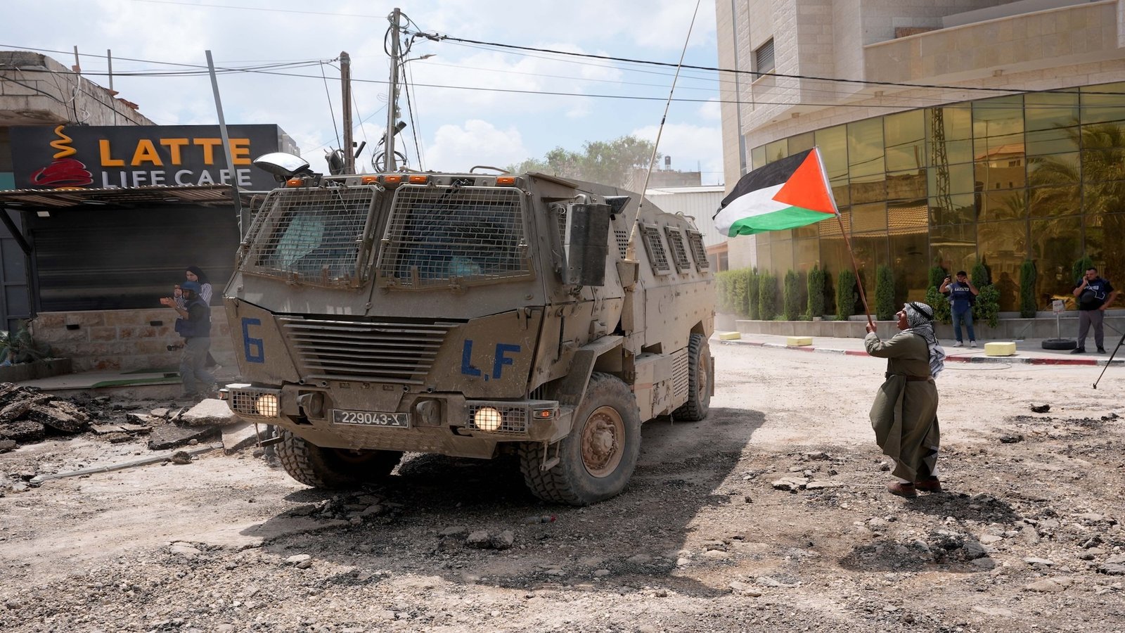 NUR SHAMS CAMP, WEST BANK - AUGUST 29: Israeli army patrols at the streets during raid on Nur Shams near the city of Tulkarm after launching a large-scale military offensive in the West Bank, on August 29, 2024. During the raid, the Israeli army demolished residential areas and destroyed the infrastructure with heavy duty machines and bulldozers. (Photo by Issam Rimawi/Anadolu via Getty Images)