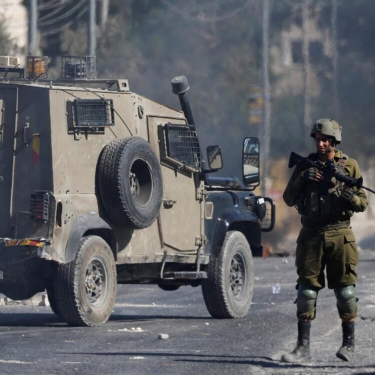 Members of the Israeli security forces stand during clashes following the funeral of seven-year-old Palestinian boy Rayyan Suleiman, who according to his father has died of heart failure while being chased by Israeli soldiers, east of Bethlehem, Israeli-occupied West Bank September 30, 2022. REUTERS/Mussa Qawasma