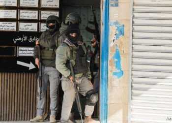 Palestinian security forces take position during clashes with militants at the camp, in Jenin in the Israeli-occupied West Bank, December 14, 2024. REUTERS/Raneen Sawafta