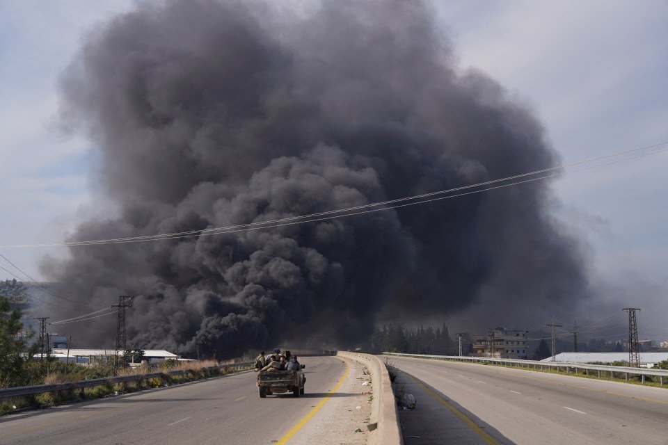 smoke rises members syrian forces 977992430