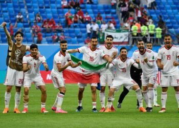 Iran's players celebrate at the end of the Russia 2018 World Cup Group B football match between Morocco and Iran at the Saint Petersburg Stadium in Saint Petersburg on June 15, 2018. (Photo by CHRISTOPHE SIMON / AFP) / RESTRICTED TO EDITORIAL USE - NO MOBILE PUSH ALERTS/DOWNLOADS        (Photo credit should read CHRISTOPHE SIMON/AFP/Getty Images)