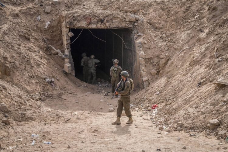 13 September 2024, Palestinian Territories, Rafah: A photograph, taken during an embed with the Israeli Defense Forces (IDF) and reviewed by the IDF censorship office prior to publication, shows Israeli soldiers standing near the entrance of a tunnel. Photo: Ilia Yefimovich/dpa