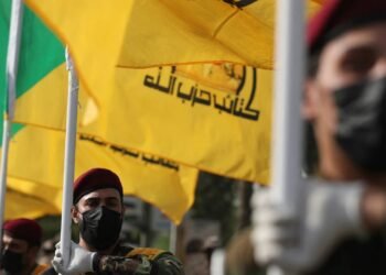 kataeb hezbollah funeral iraq flags afp.jpg