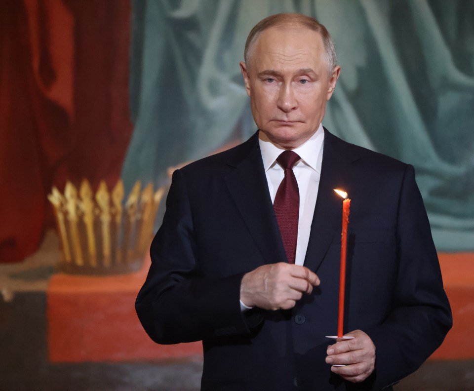 russian president vladimir putin crosses 988516274