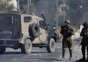 Members of the Israeli security forces stand during clashes following the funeral of seven-year-old Palestinian boy Rayyan Suleiman, who according to his father has died of heart failure while being chased by Israeli soldiers, east of Bethlehem, Israeli-occupied West Bank September 30, 2022. REUTERS/Mussa Qawasma