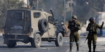 Members of the Israeli security forces stand during clashes following the funeral of seven-year-old Palestinian boy Rayyan Suleiman, who according to his father has died of heart failure while being chased by Israeli soldiers, east of Bethlehem, Israeli-occupied West Bank September 30, 2022. REUTERS/Mussa Qawasma
