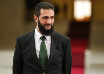 (FILES) A handout picture released by Syria's transitional government shows the country's new leader Ahmed al-Sharaa waiting for the arrival of Spain's foreign minister at the presidential palace in Damascus on January 16, 2025. Syria's new authorities announced on January 29, 2025, that Ahmed al-Sharaa, who took the helm after longtime ruler Bashar al-Assad's ouster last month, was appointed interim president and tasked with forming a transitional legislature, state media reported. (Photo by Syria's Transitional Government / AFP) / RESTRICTED TO EDITORIAL USE - MANDATORY CREDIT "AFP PHOTO /SYRIA'S TRANSITIONAL GOVERNMENT  " - NO MARKETING NO ADVERTISING CAMPAIGNS - DISTRIBUTED AS A SERVICE TO CLIENTS