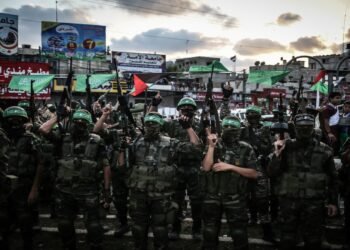 GAZA CITY, GAZA - AUGUST 21: Members of Ezzedin al-Qassam Brigades, the armed wing of the Hamas movement, take part in a military parade marking the one-year death anniversary of three al-Qassam commanders Raed al-Attar, Mohammed Abu Shamala, and Mohammed Barhoum on August 21, 2015 in Rafah town, southern Gaza Strip. (Photo by Ali Hassan/Anadolu Agency/Getty Images)