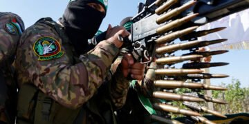 FILE PHOTO: A Palestinian fighter from the armed wing of Hamas takes part in a military parade to mark the anniversary of the 2014 war with Israel, near the border in the central Gaza Strip, July 19, 2023. REUTERS/Ibraheem Abu Mustafa/File Photo